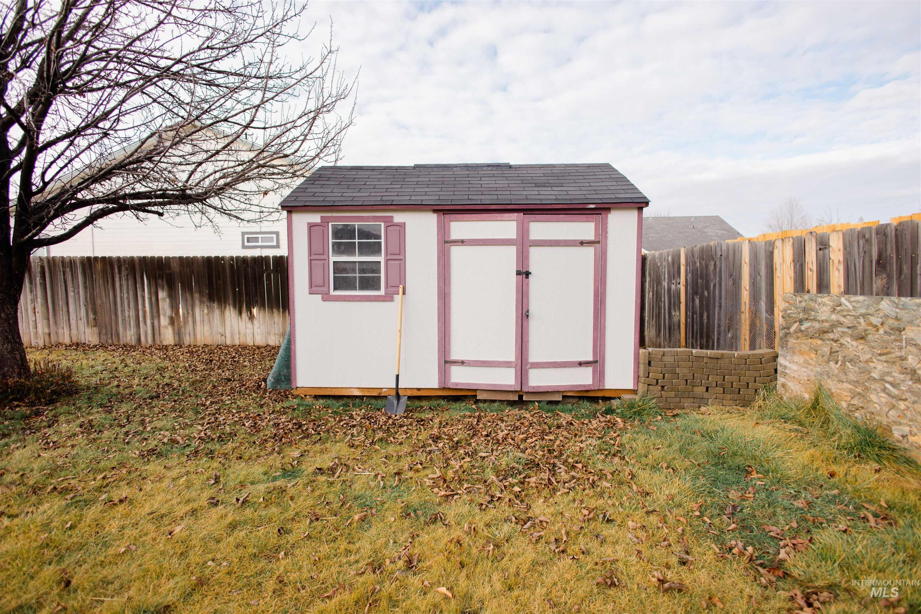 View of shed featuring a fenced backyard