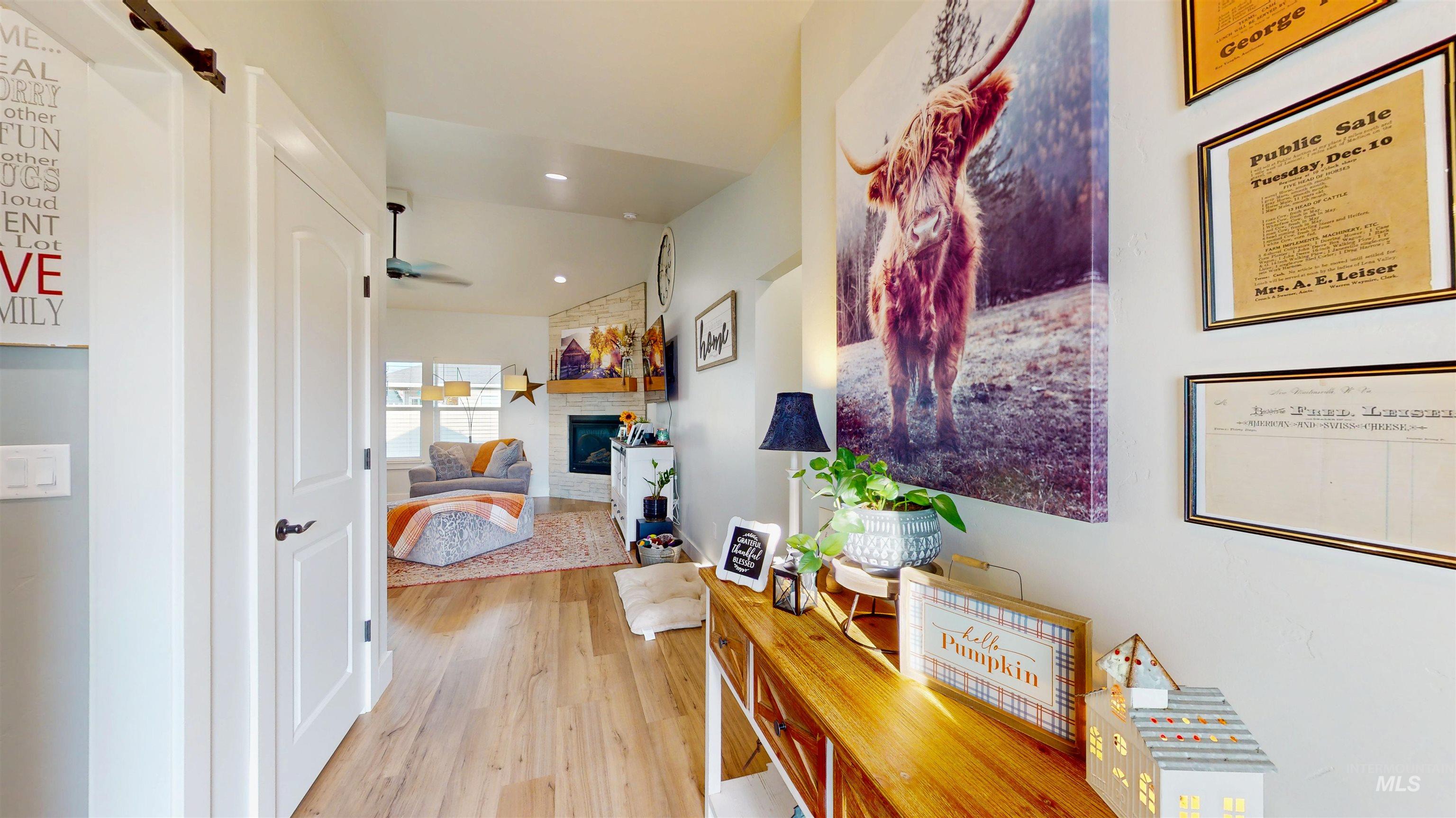 Corridor featuring light wood-style flooring and recessed lighting