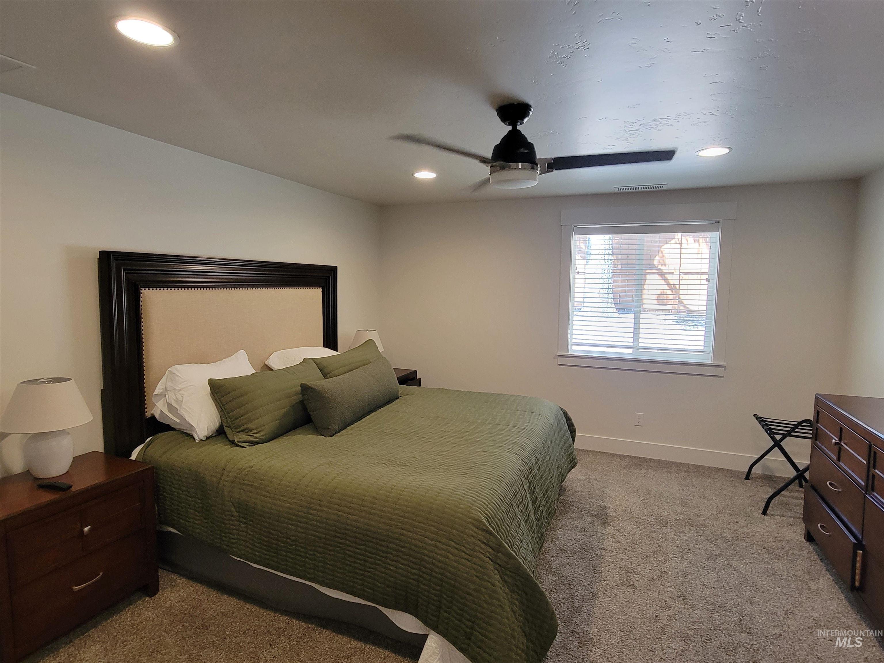 Bedroom featuring carpet flooring, recessed lighting, and a ceiling fan
