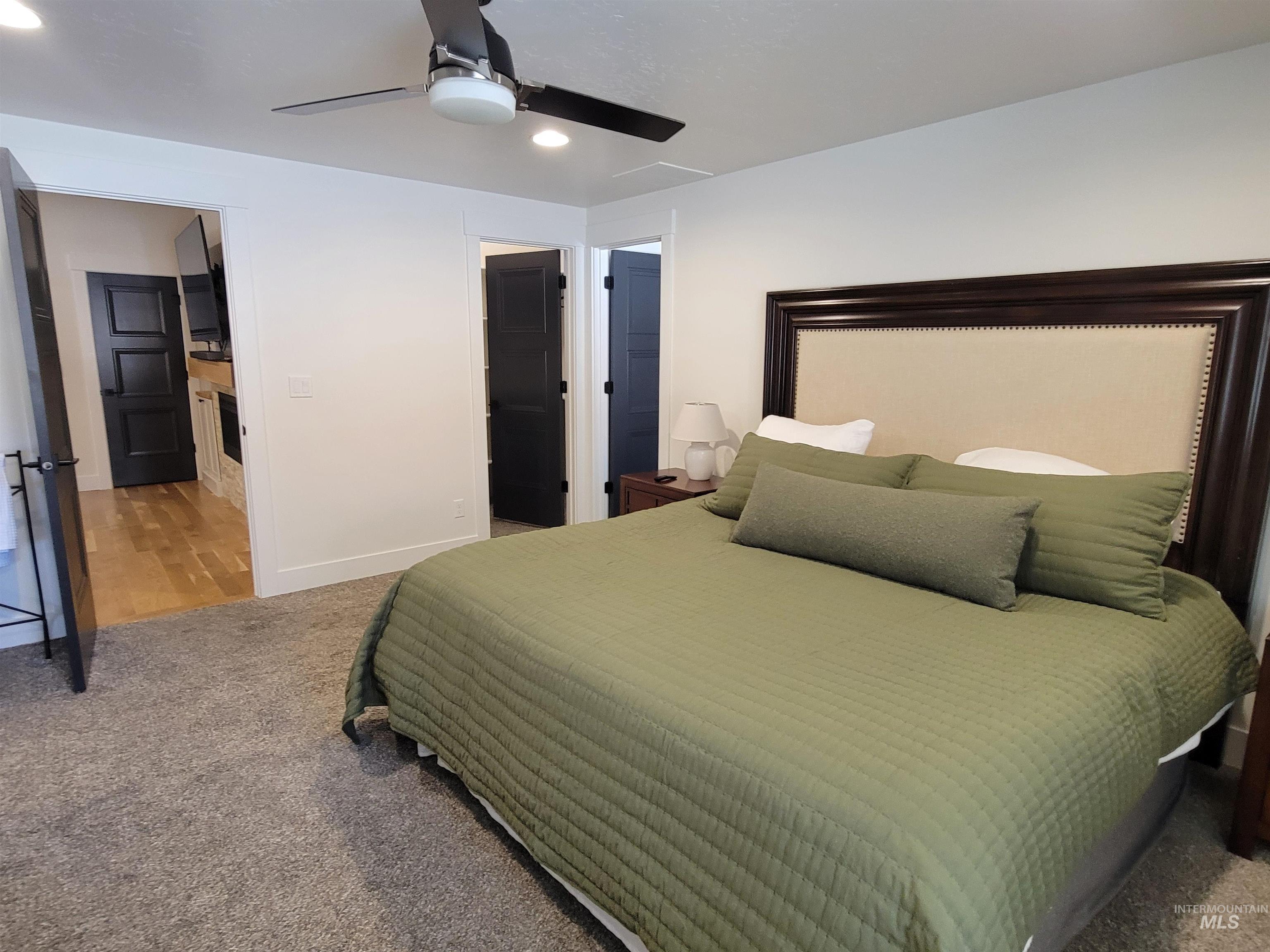 Carpeted bedroom featuring recessed lighting and ceiling fan