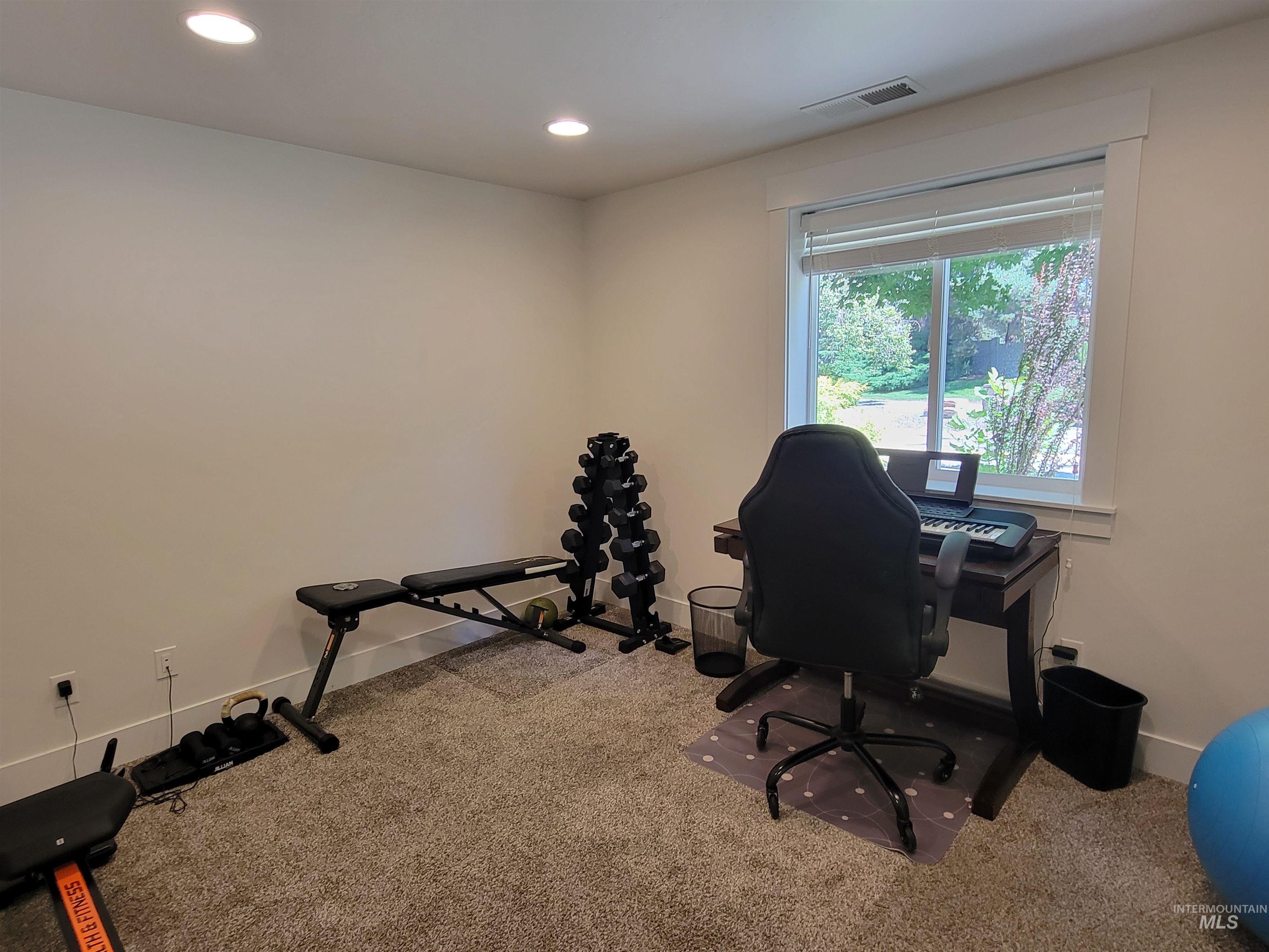 Office area featuring carpet flooring and recessed lighting