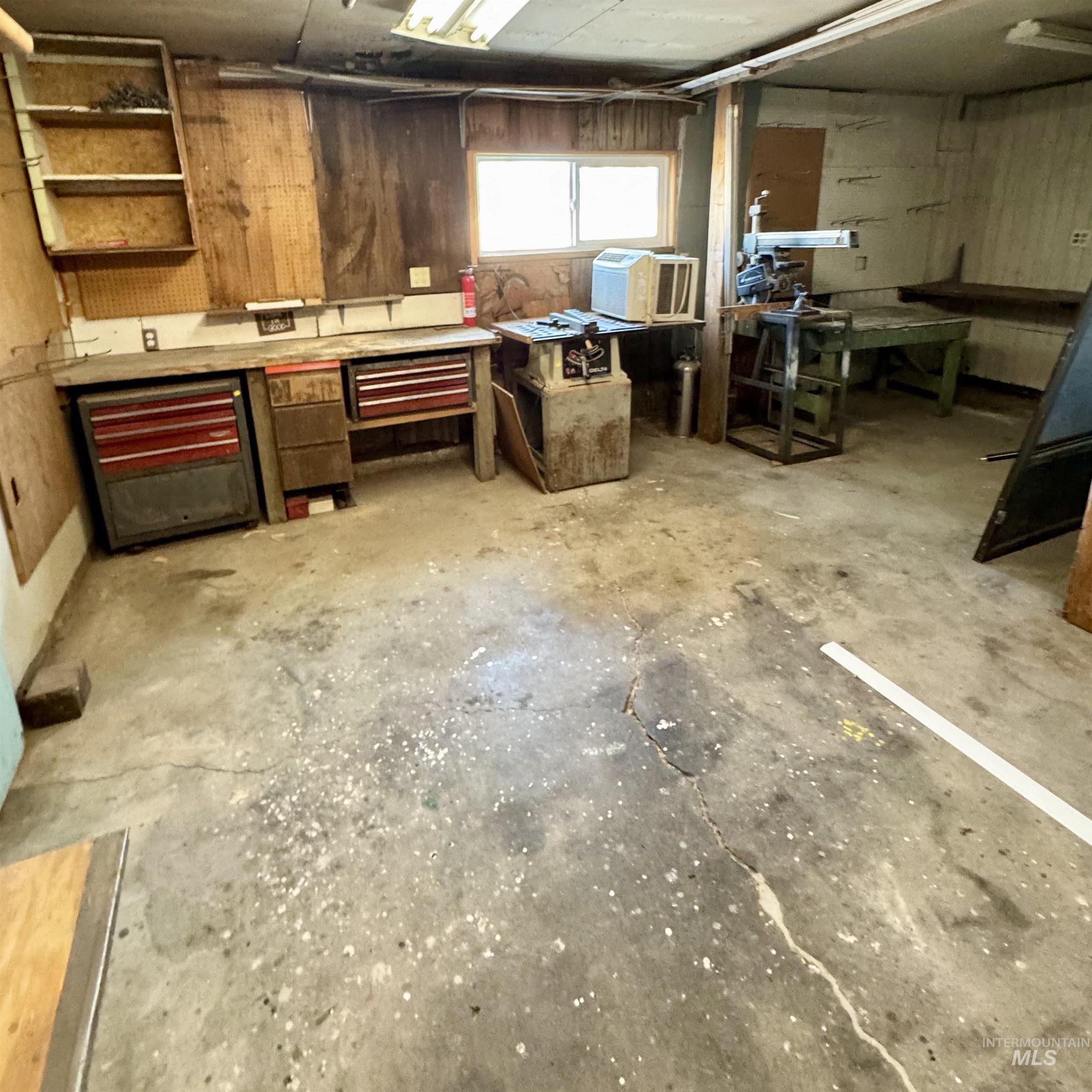 Garage featuring a workshop area