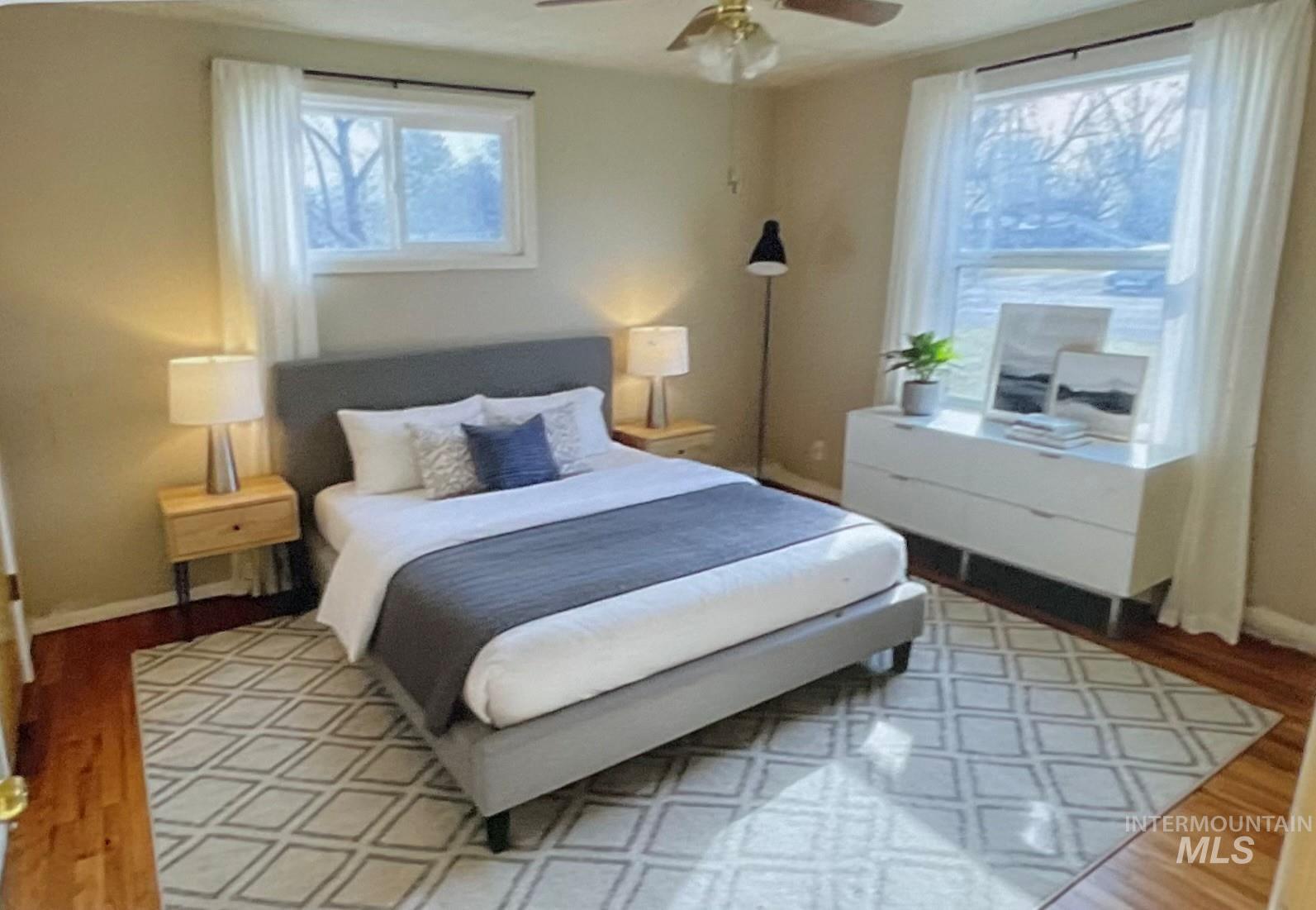 Bedroom with wood finished floors and ceiling fan