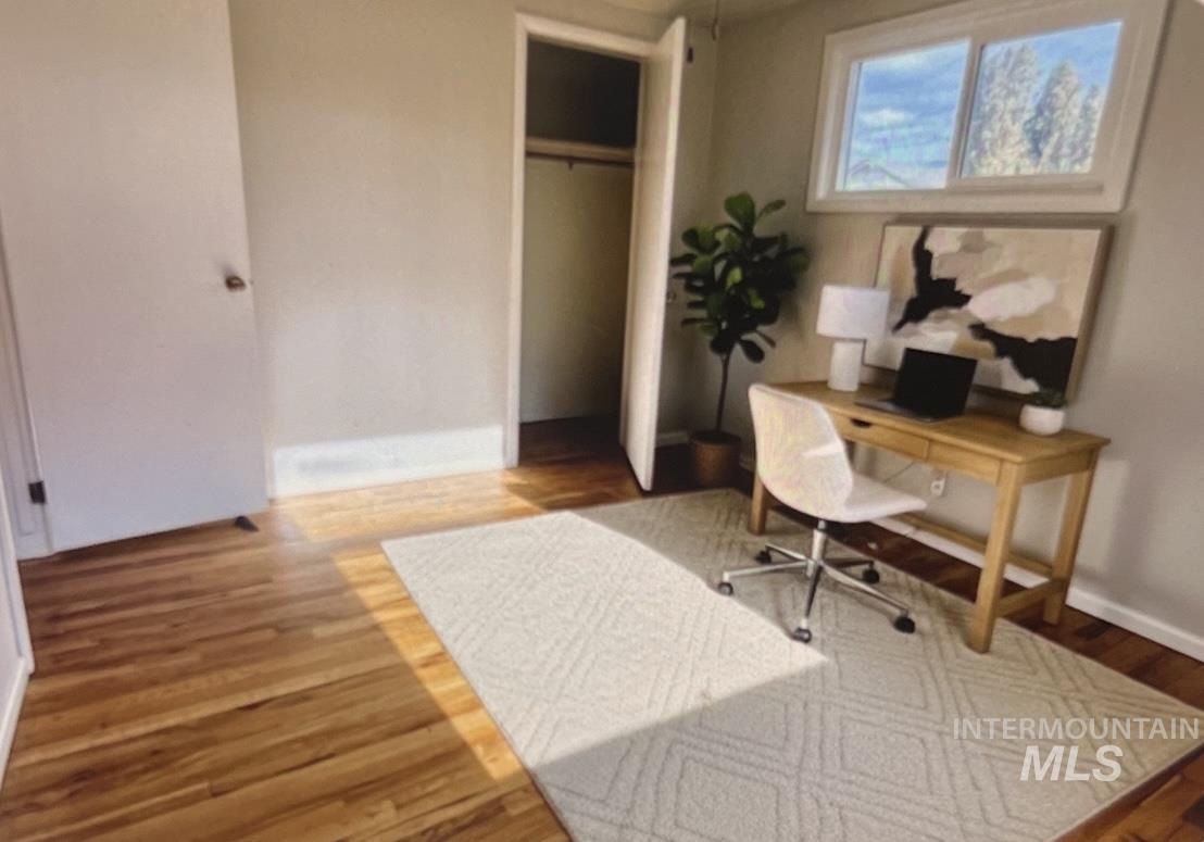Office with light wood-style flooring
