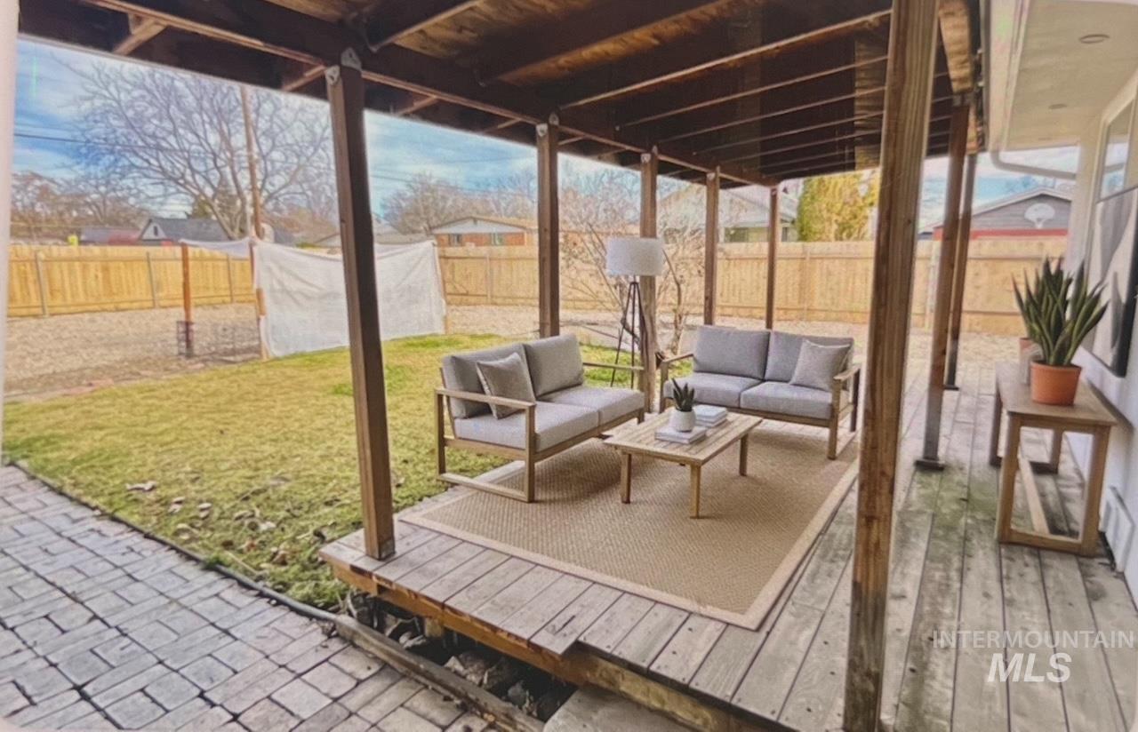 Sunroom / solarium featuring an outdoor hangout area, plenty of natural light, and a deck