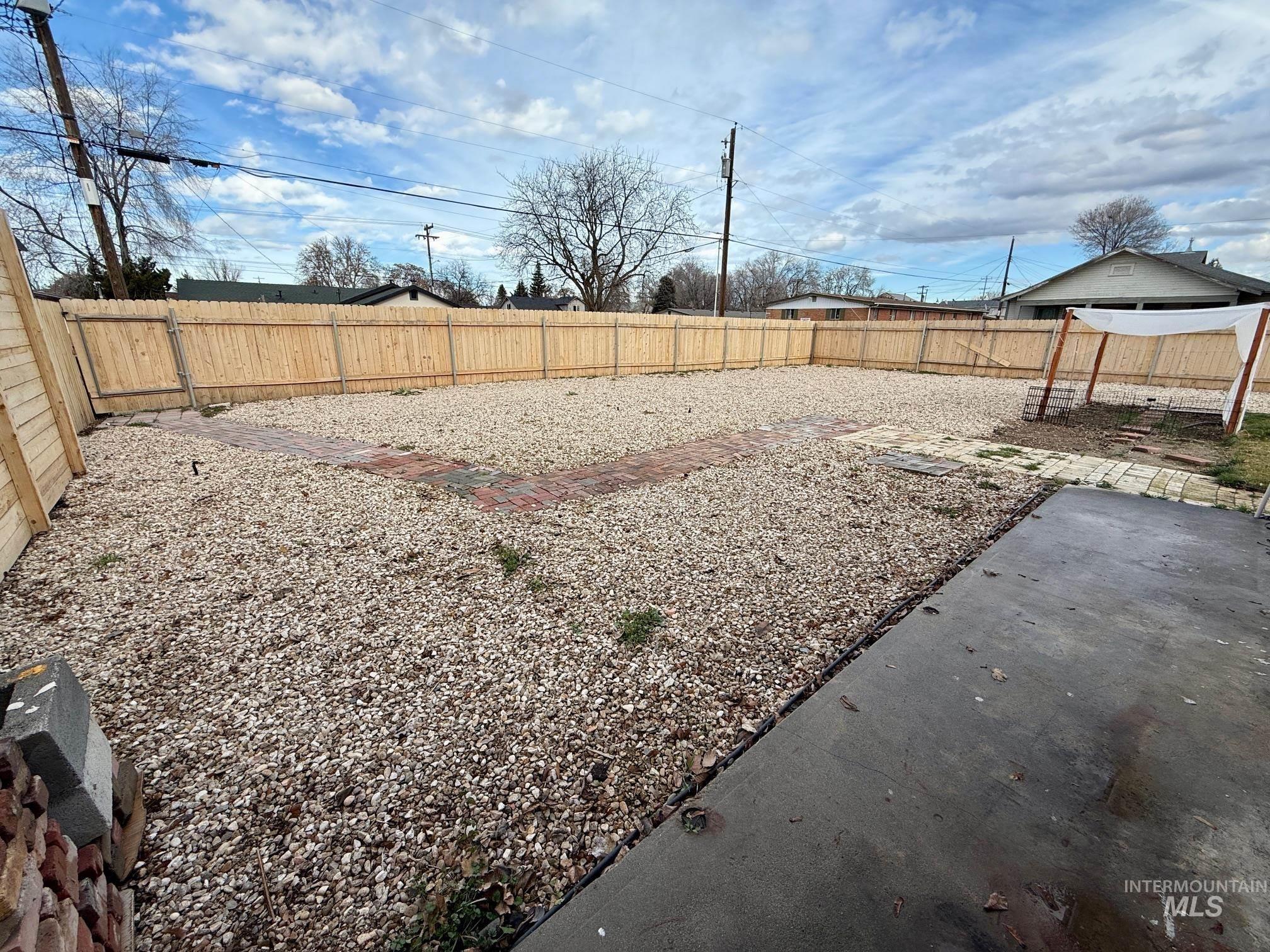 View of fenced backyard