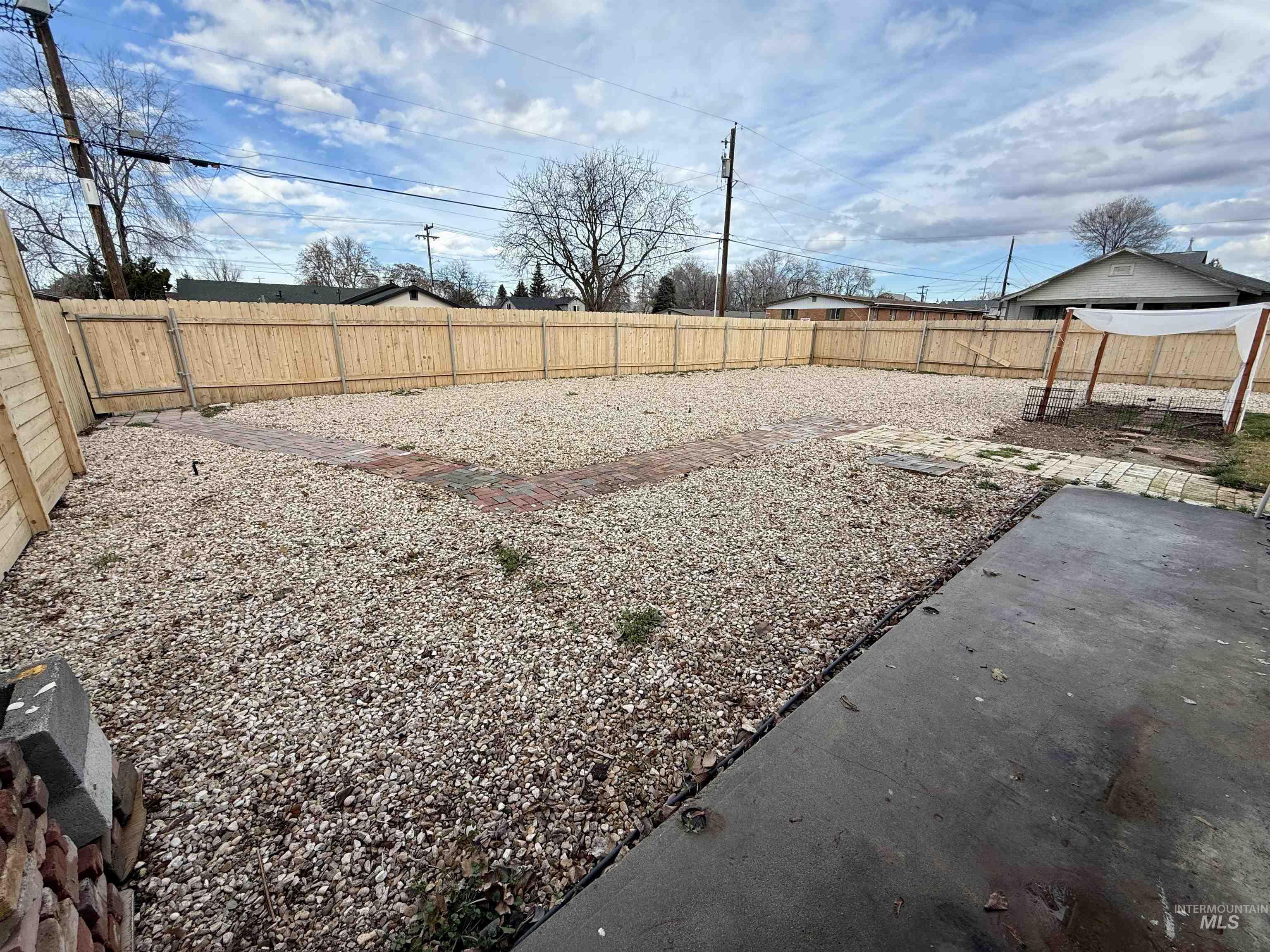 View of fenced backyard