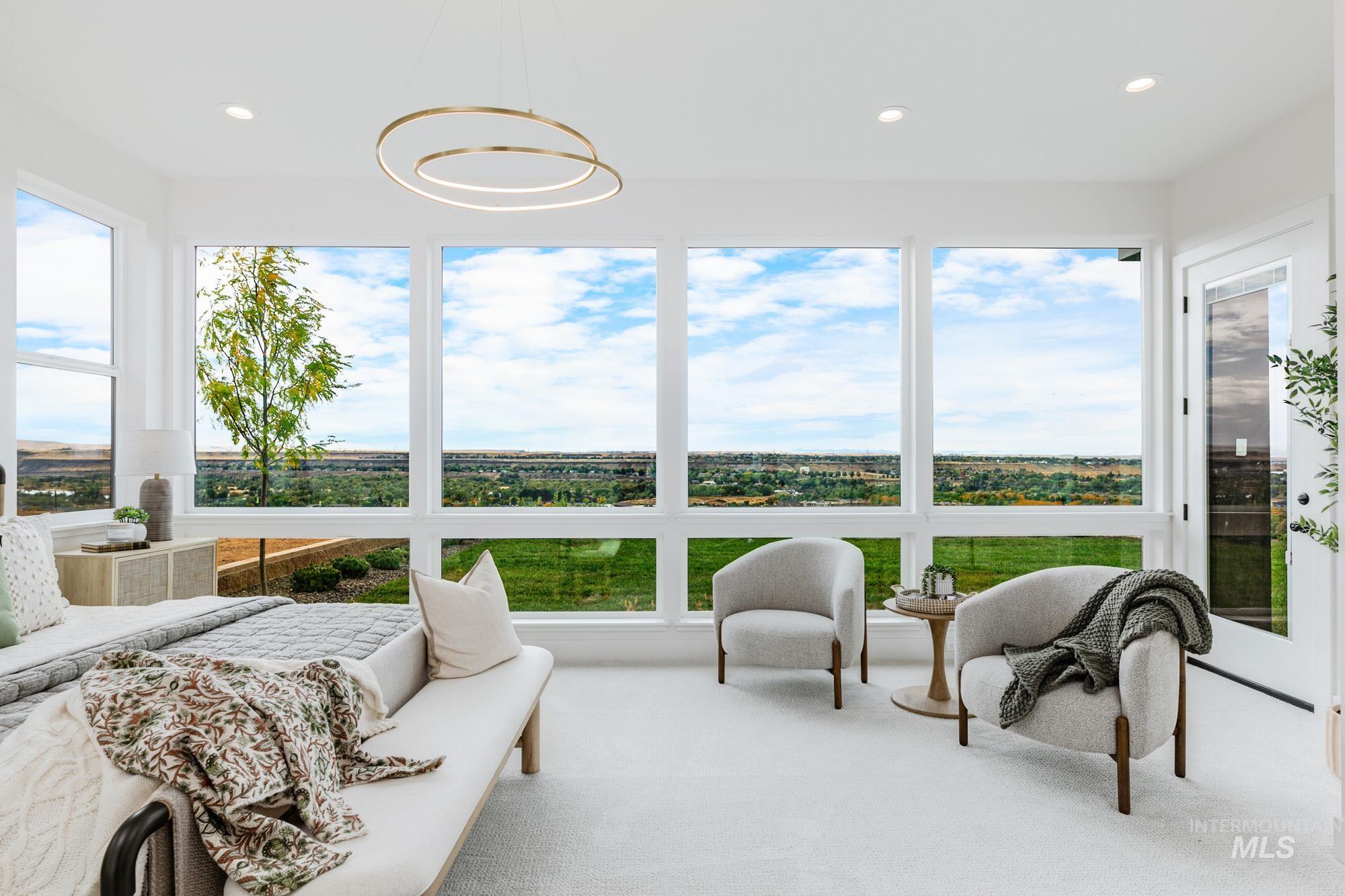 Sunroom / solarium with plenty of natural light, carpet, and recessed lighting