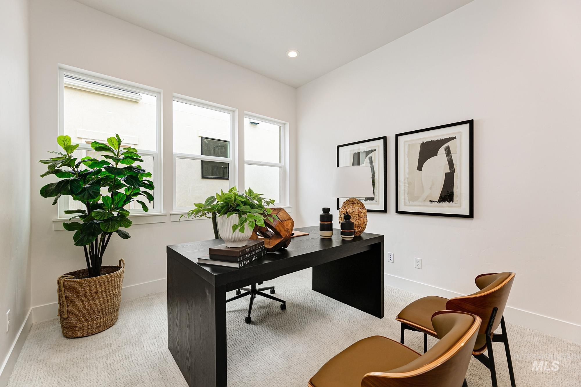 Office area featuring light carpet and recessed lighting