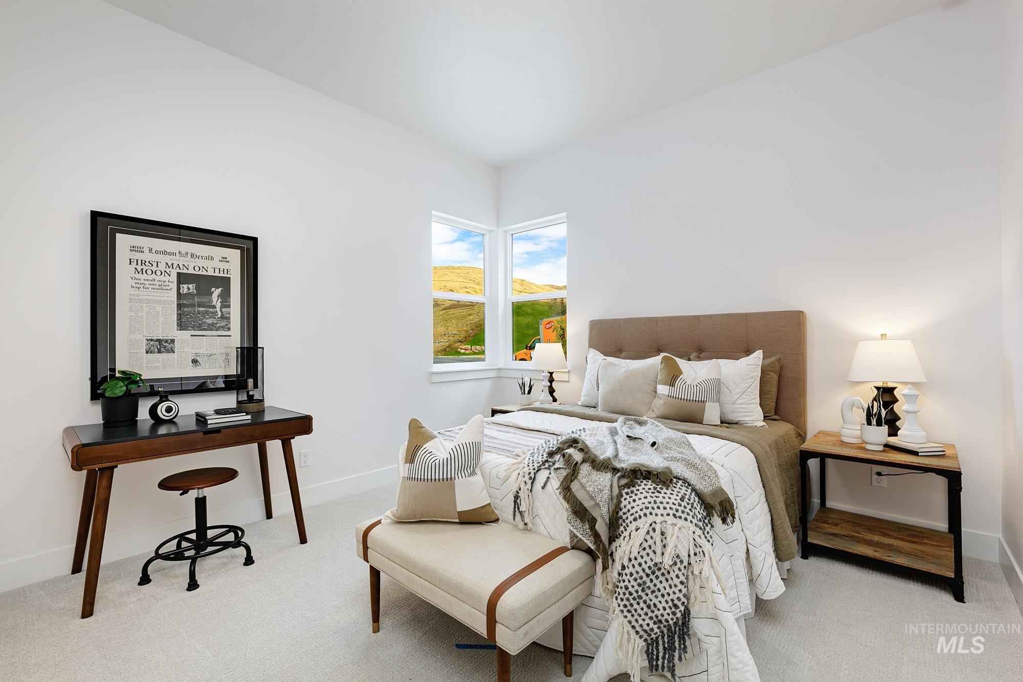 Bedroom with light colored carpet