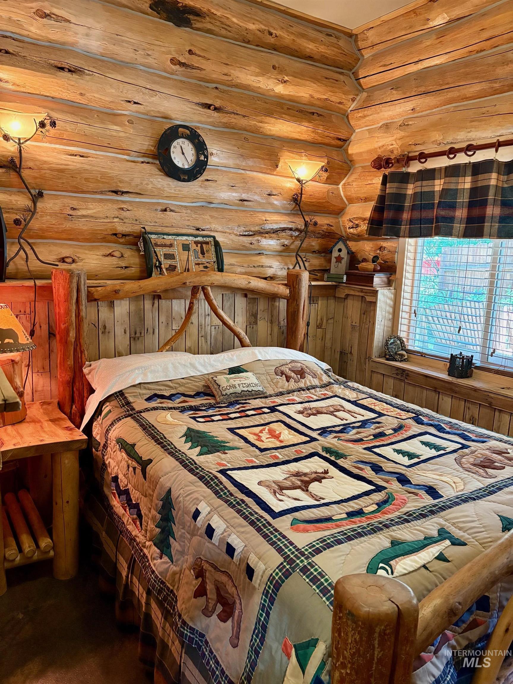 Bedroom with log walls