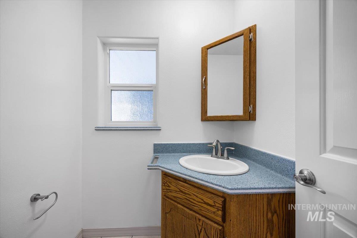 Half bathroom featuring vanity