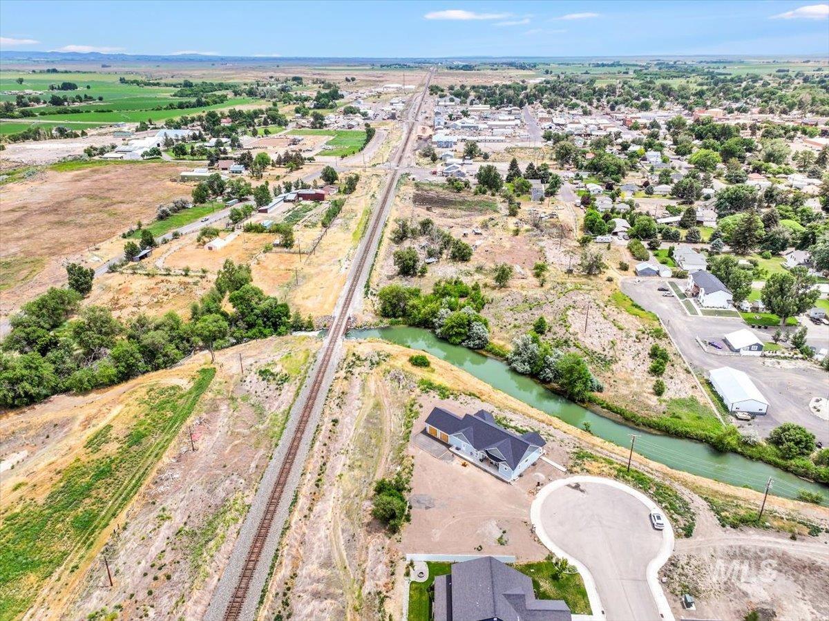 Aerial view of property's location with a nearby body of water