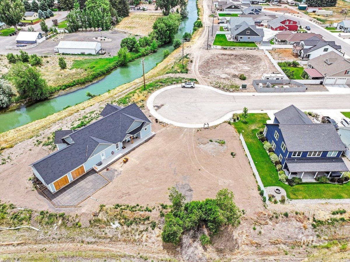 Aerial perspective of suburban area with a nearby body of water
