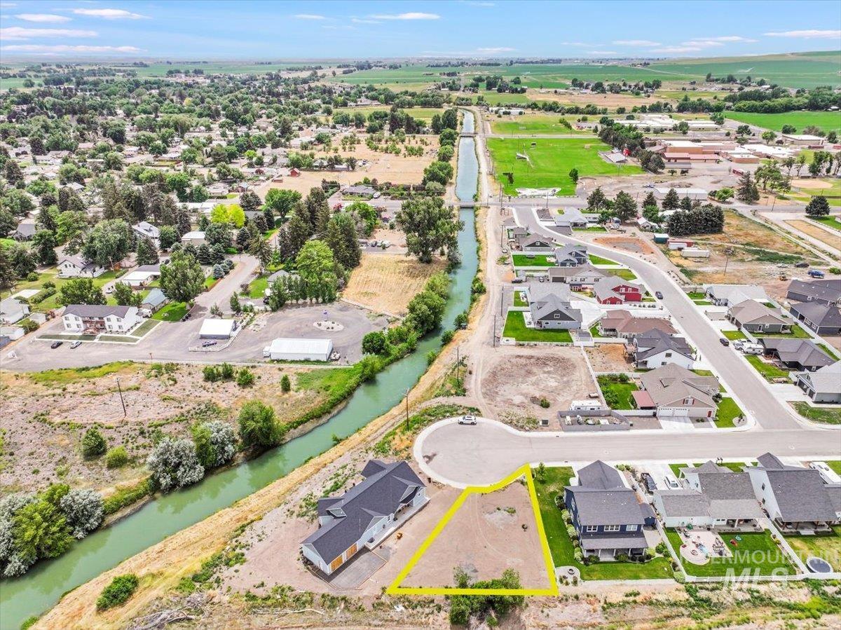 View of property location featuring property parcel outlined and nearby suburban area