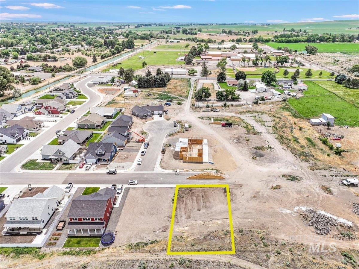 Aerial view of residential area with property boundaries highlighted