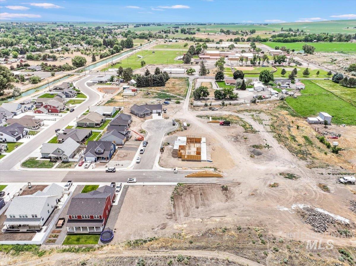 Aerial view of property's location featuring nearby suburban area