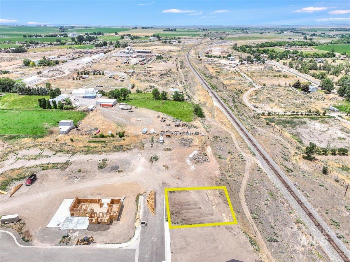 Aerial view of sparsely populated area featuring property parcel outlined
