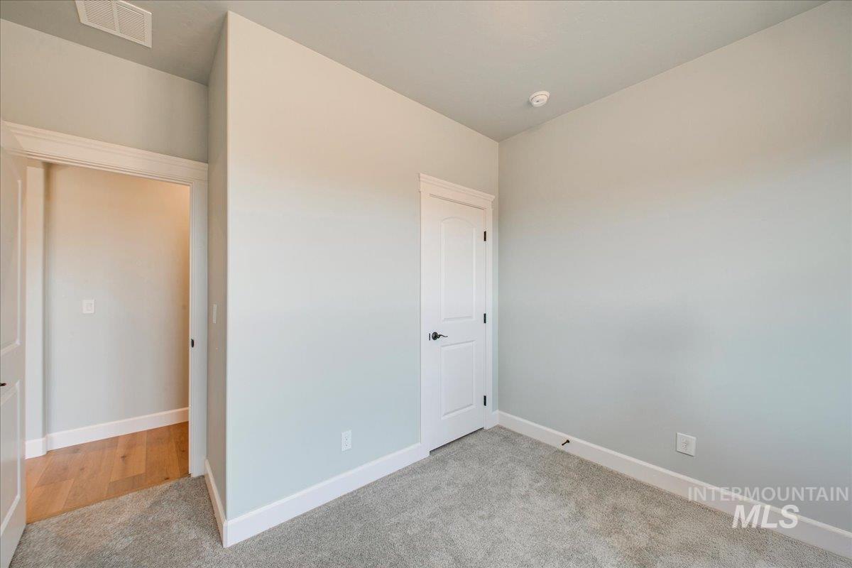 Unfurnished bedroom featuring carpet