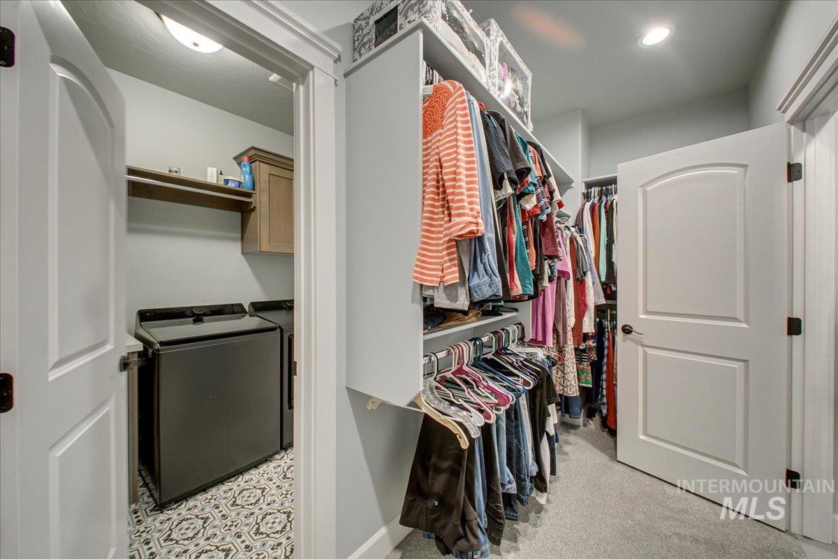 Spacious closet that connects to the laundry room for easy access to the washer and dryer