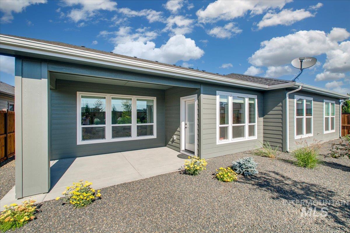 Rear view of house featuring a patio area