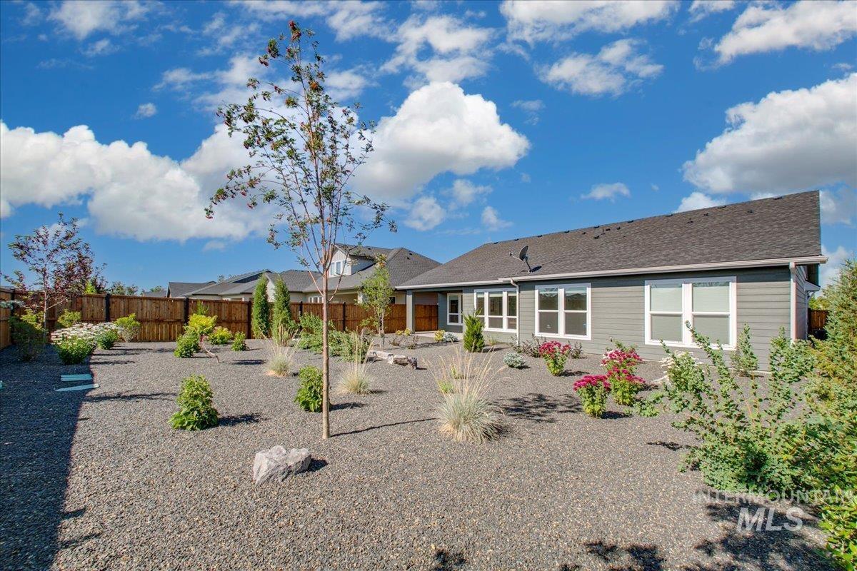 Back of house featuring a fenced backyard