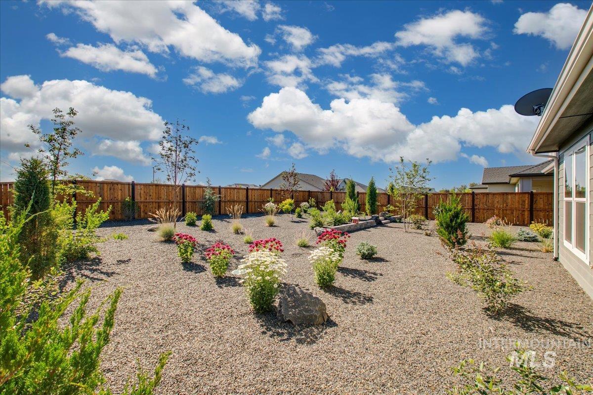 Fenced backyard with a patio