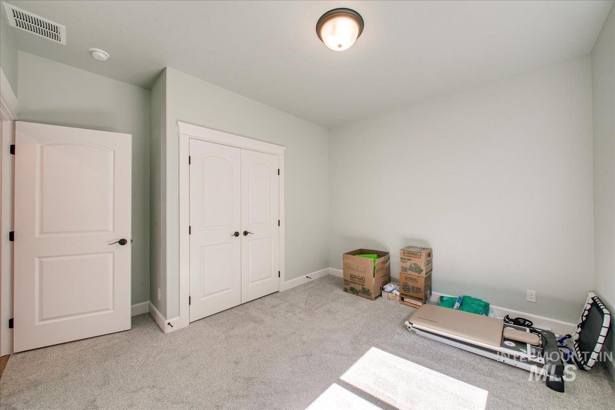 light colored carpet and baseboards