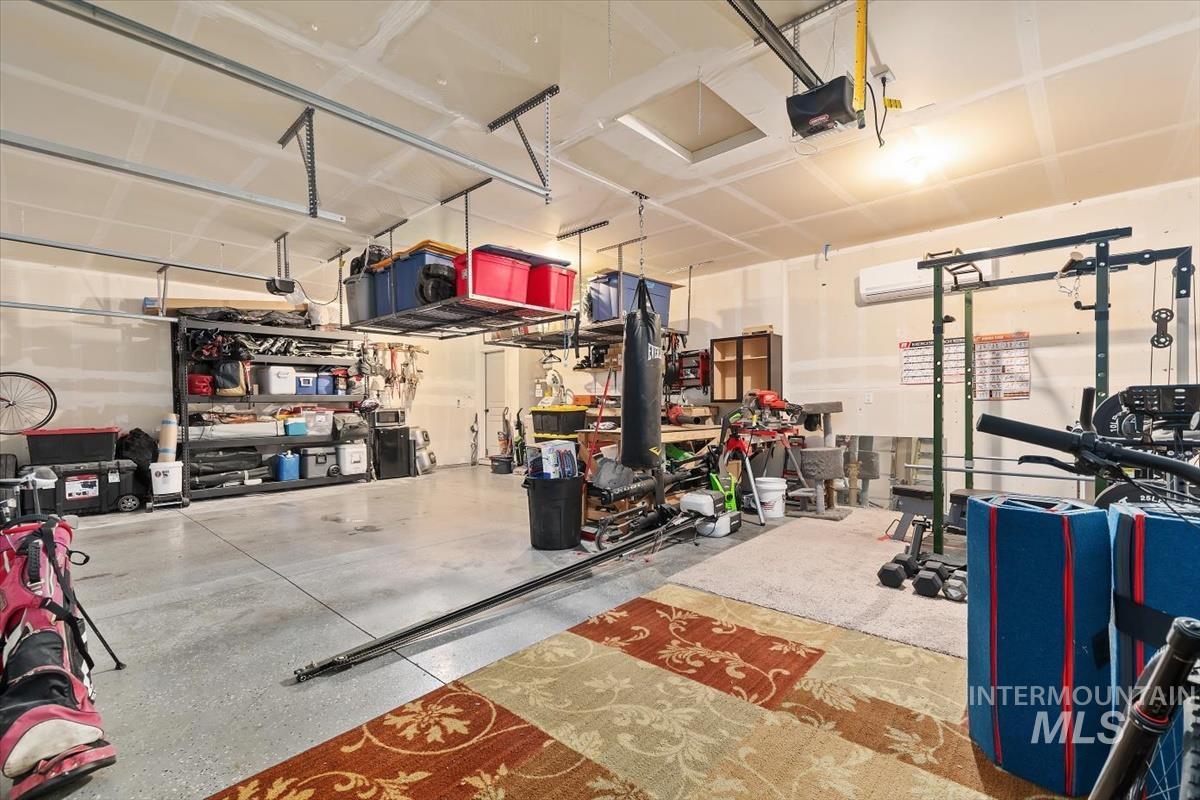 Garage featuring a garage door opener