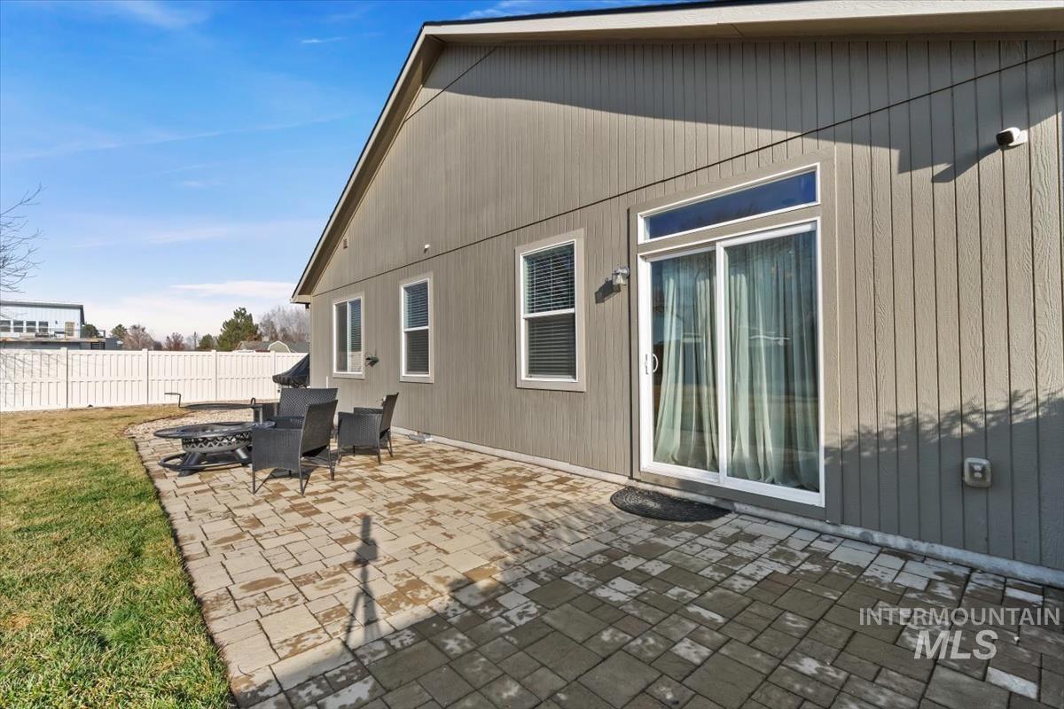 Back of property with a patio