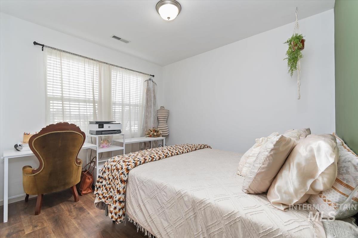 Bedroom featuring dark wood finished floors