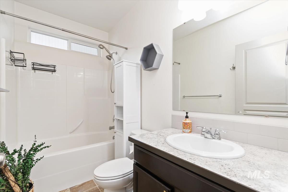 Bathroom with bathtub / shower combination and vanity
