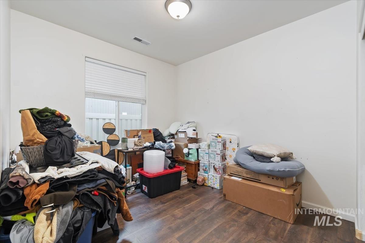 Bedroom featuring dark wood-style flooring
