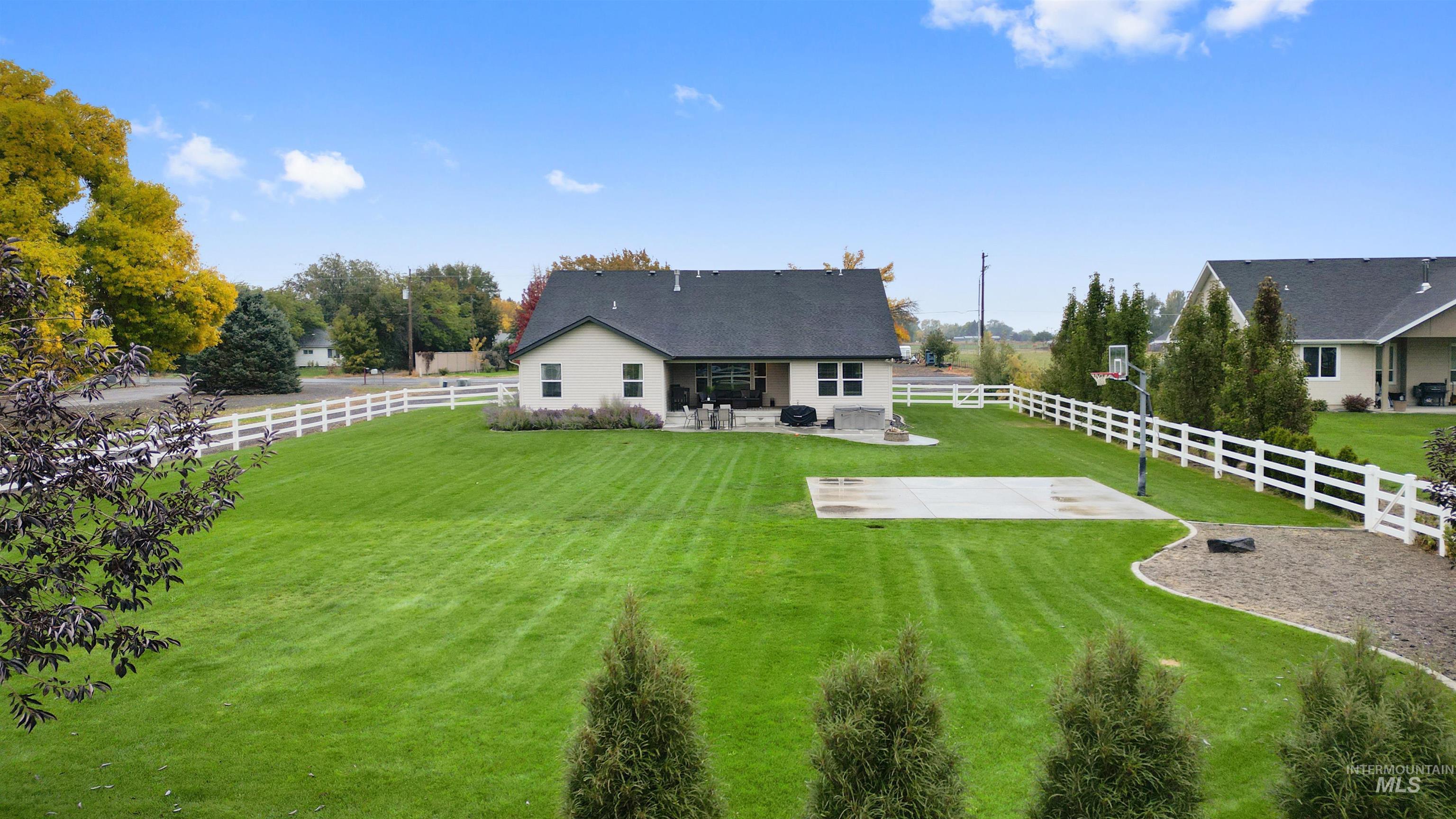 Back of property with a patio and a fenced backyard