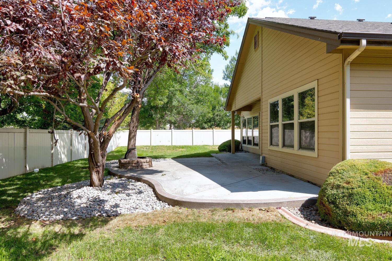Fenced backyard with a patio area