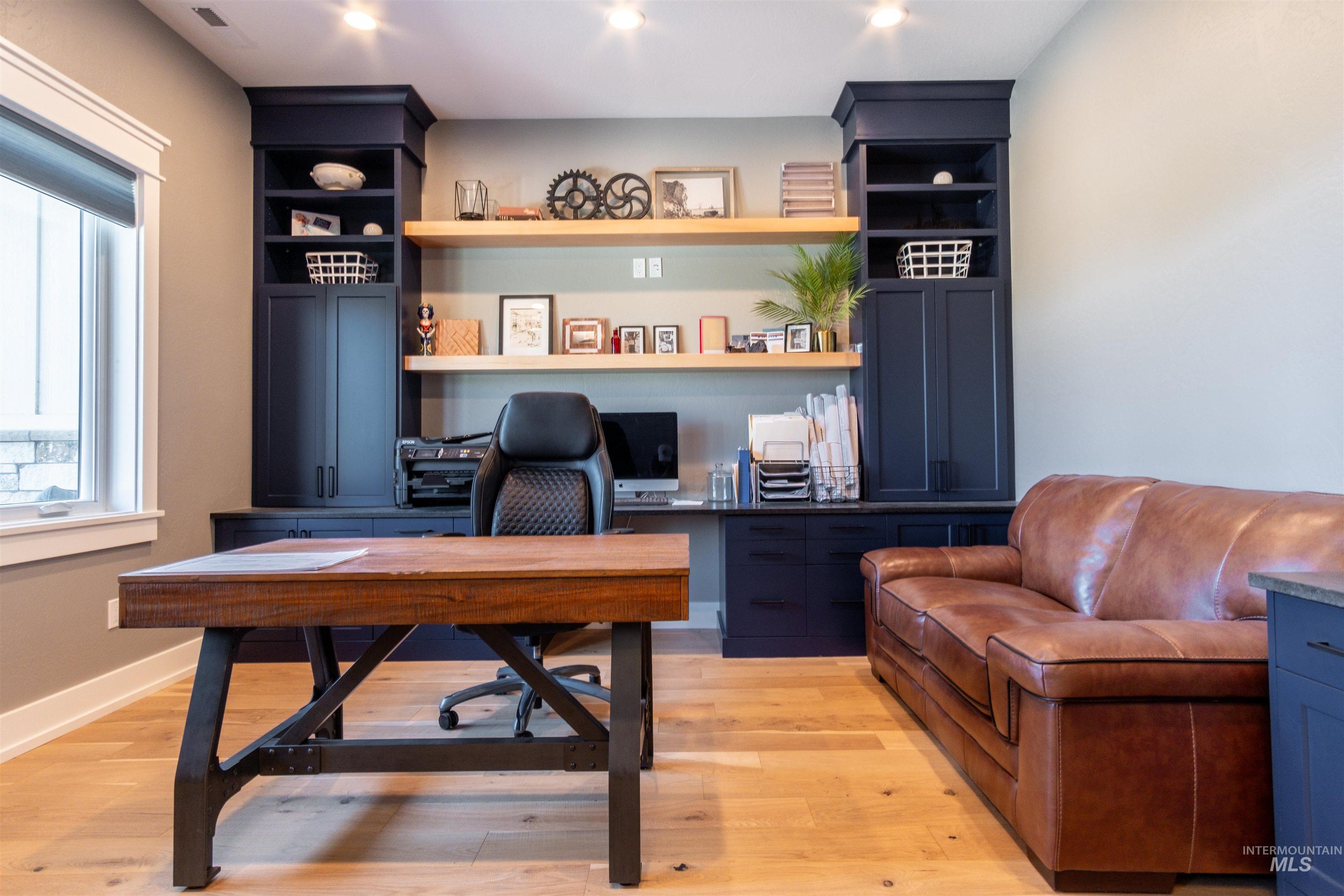 Office area featuring light wood finished floors