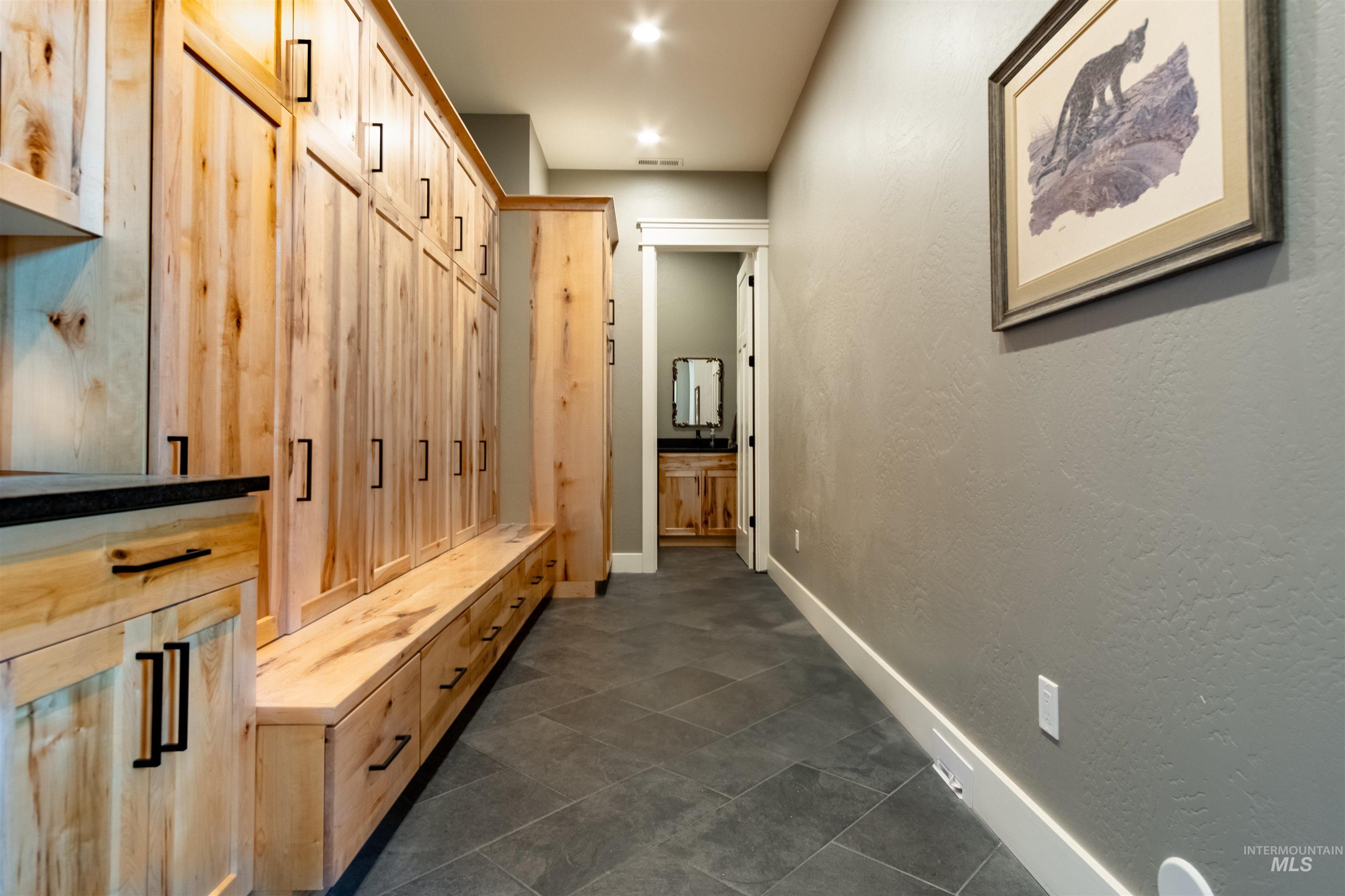 Mudroom with baseboards and recessed lighting