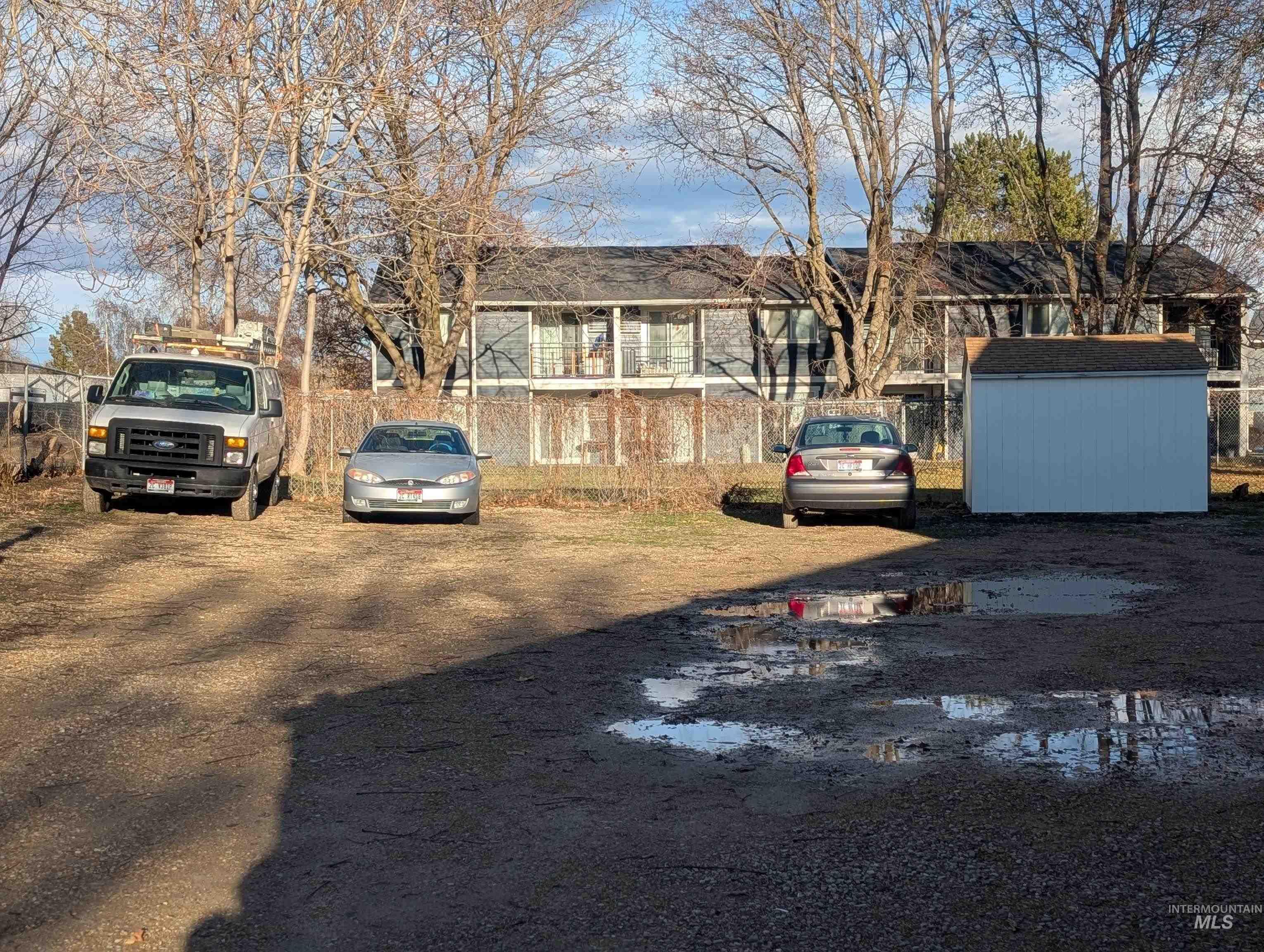 View of parking featuring a shed