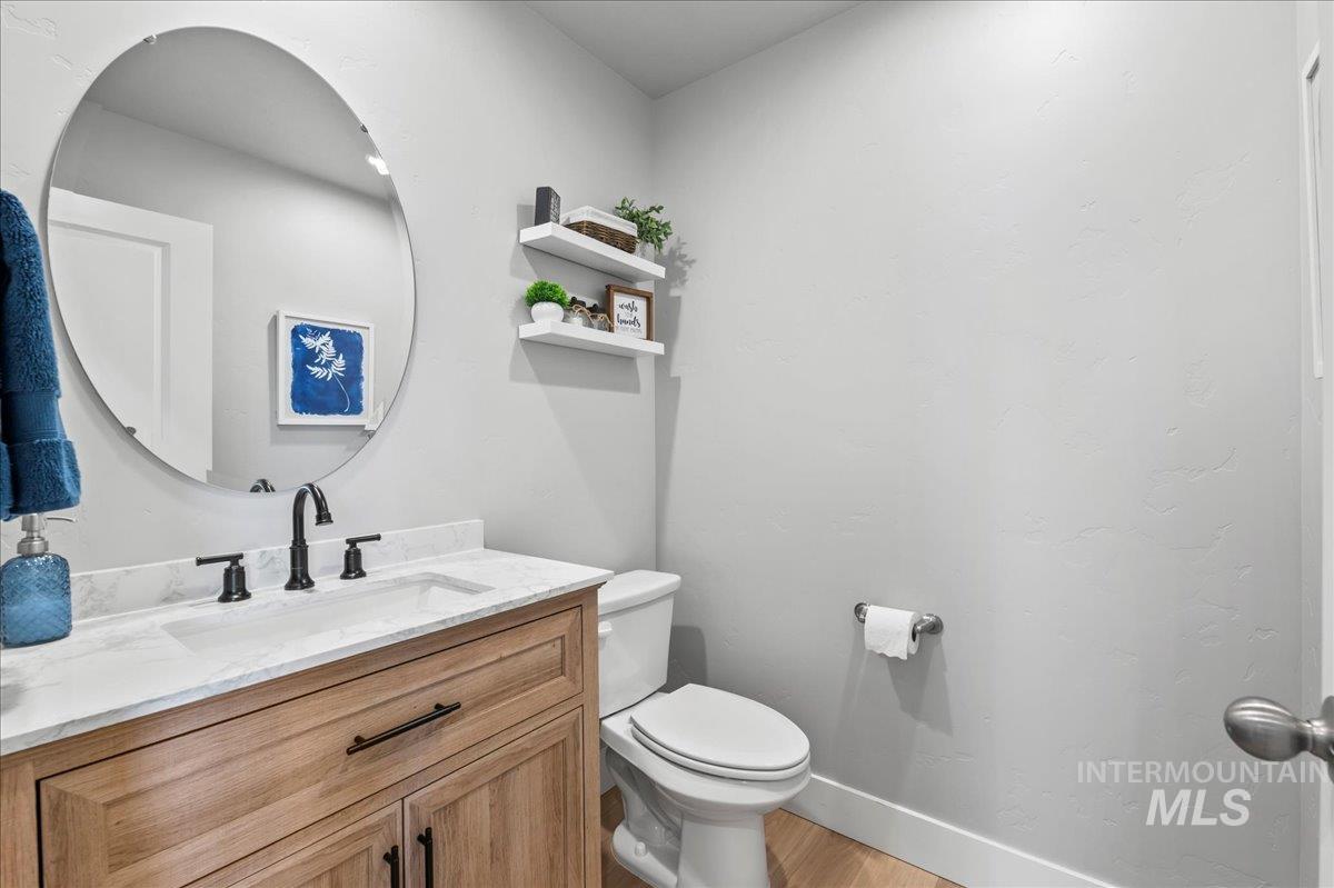 Bathroom featuring vanity and wood finished floors