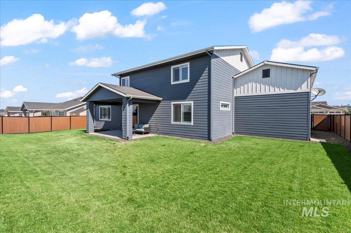 Back of property featuring a patio area and a fenced backyard