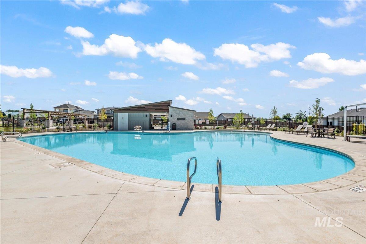 Community pool with a patio
