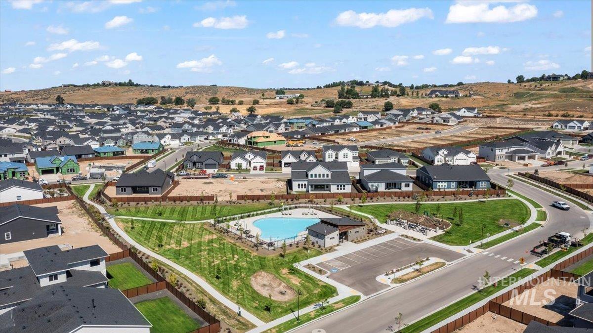 Aerial perspective of suburban area featuring a pool area