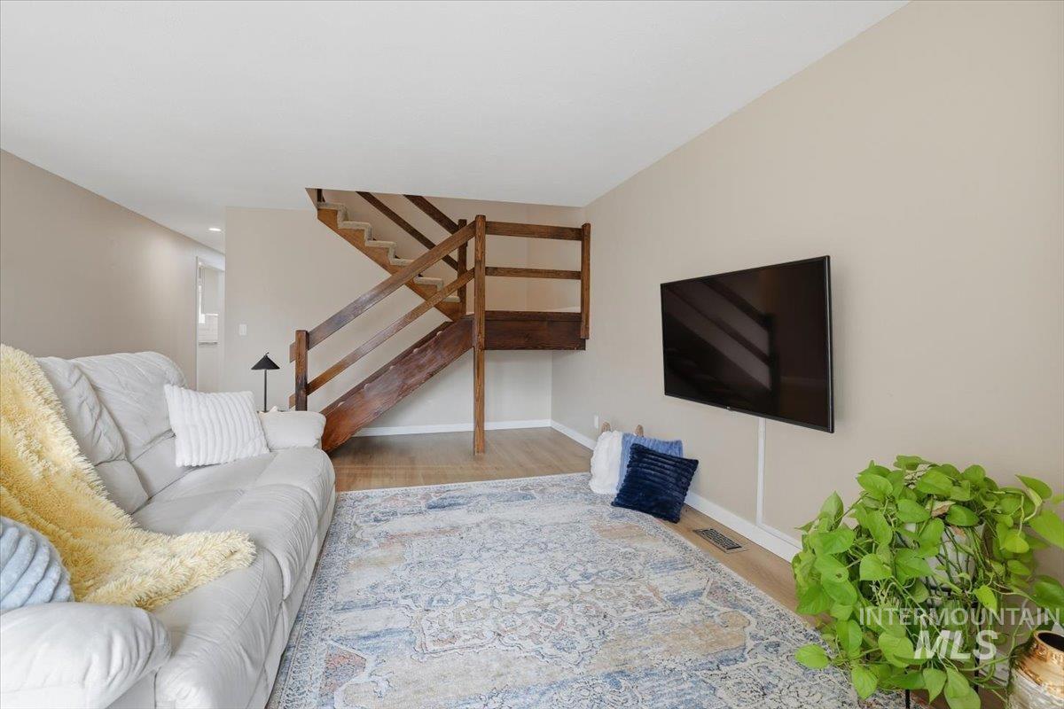 Living room with wood finished floors and baseboards