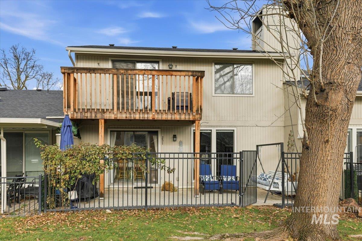 Rear view of property with a patio and a balcony