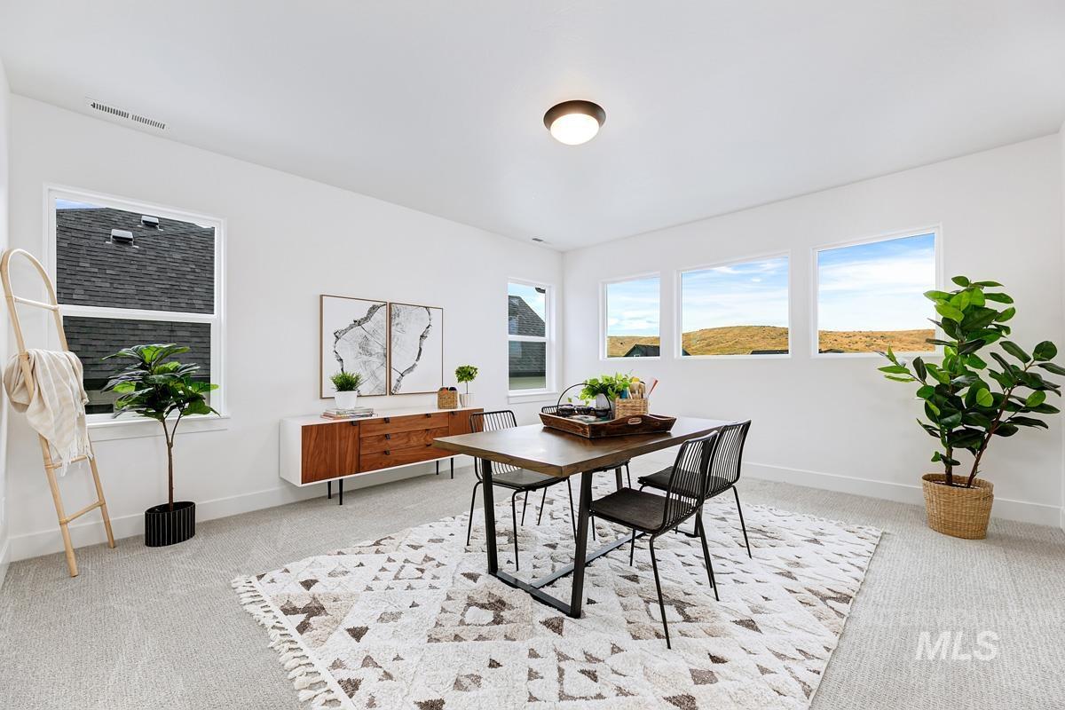 Dining space with light carpet