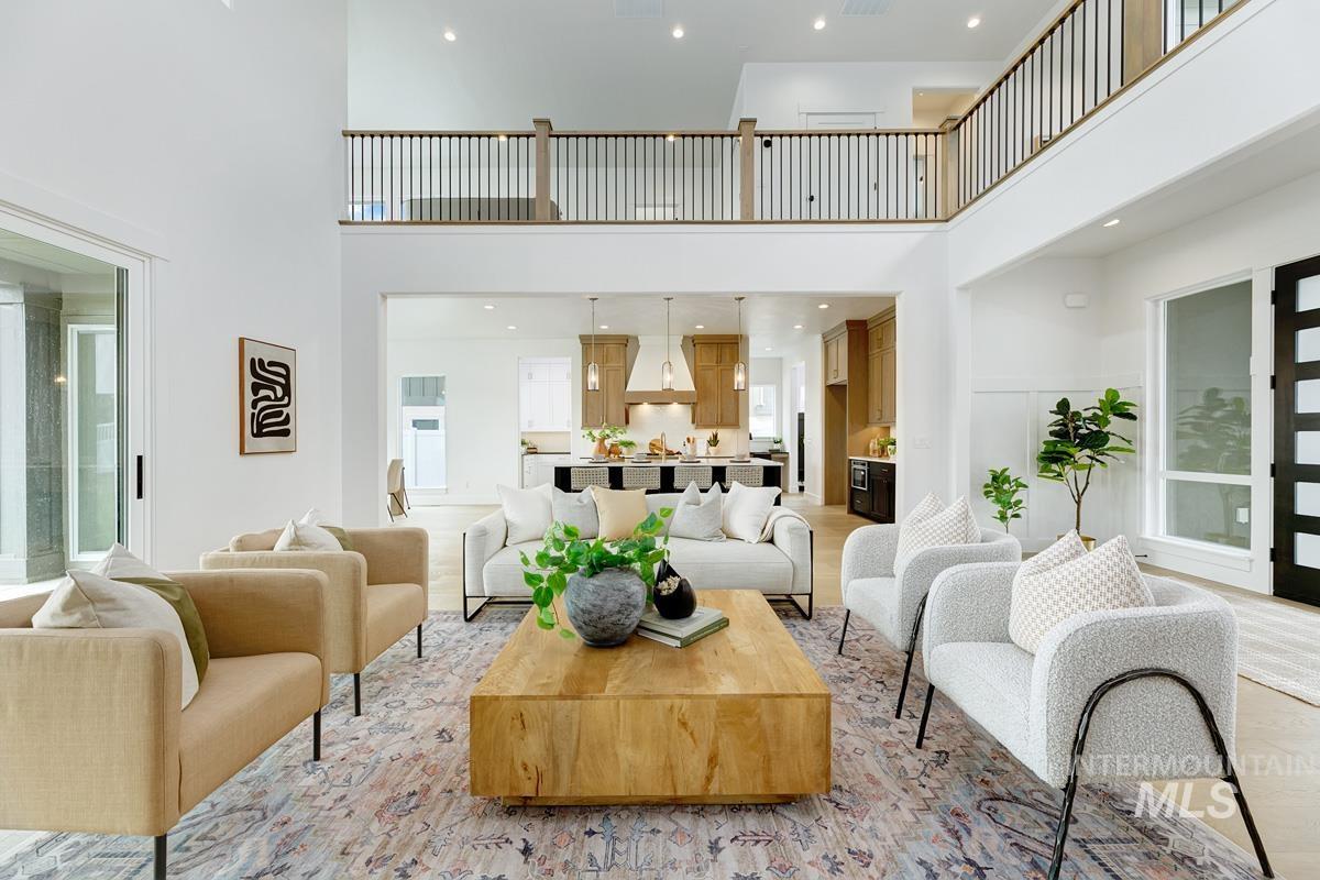 Living room featuring a high ceiling and recessed lighting