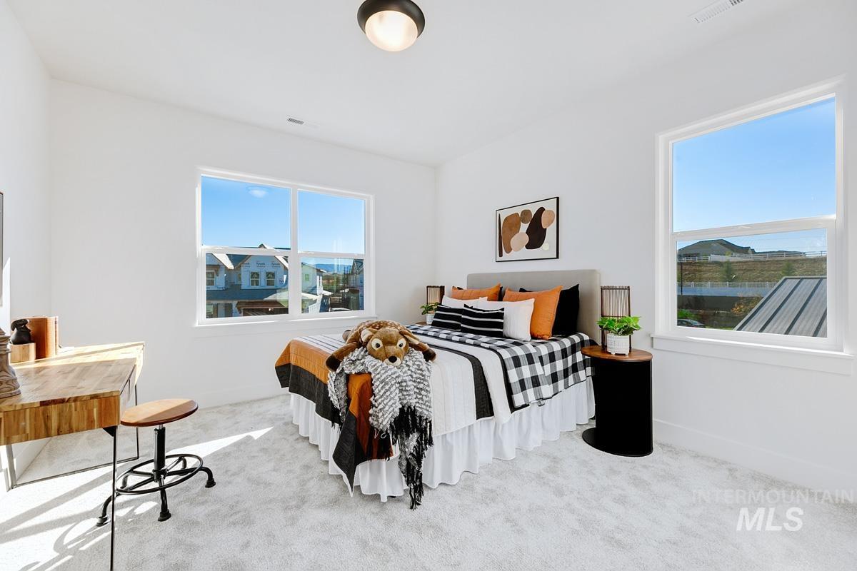 Carpeted bedroom with baseboards