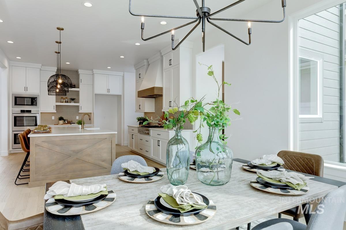 Dining area featuring a chandelier and recessed lighting