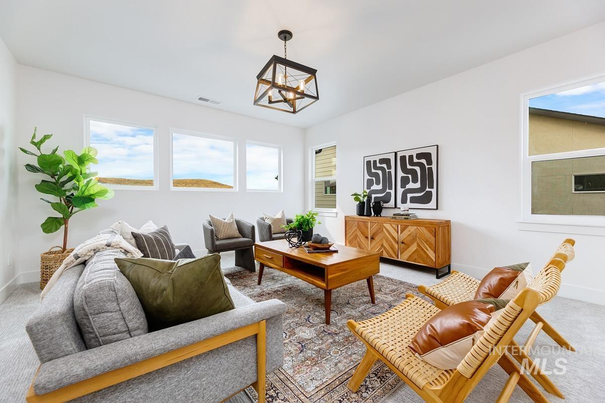 Living room with carpet floors and baseboards