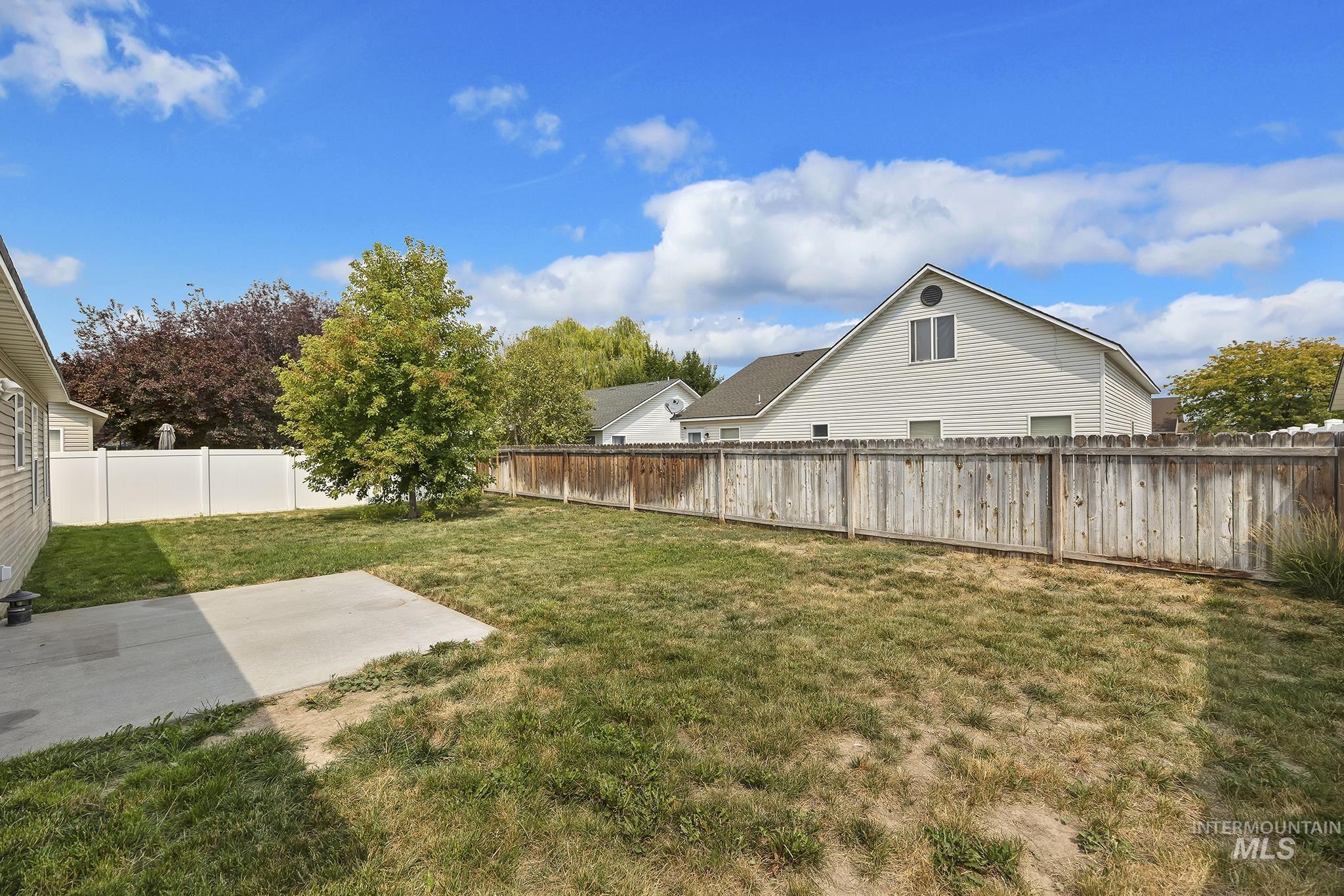 Fenced backyard featuring a patio area
